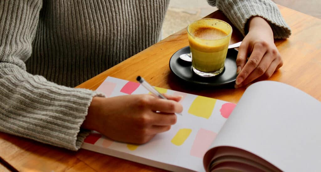 Image courtesy of Unsplash: https://unsplash.com/photos/person-holding-pen-with-coffee-on-table-5HqtJT2l9Gw
